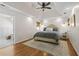 Luxurious main bedroom with a tray ceiling, wood floors, and ensuite bathroom at 4340 Hadaway Nw Rd, Kennesaw, GA 30152