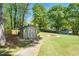 Charming backyard shed, ideal for storage or as a workshop, surrounded by a well-kept lawn at 4340 Hadaway Nw Rd, Kennesaw, GA 30152
