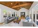 Cozy sunroom featuring a wood ceiling, hardwood floors, and comfortable seating at 4340 Hadaway Nw Rd, Kennesaw, GA 30152