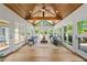 Bright sunroom with wood-paneled ceiling, hardwood floors, and lots of natural light at 4340 Hadaway Nw Rd, Kennesaw, GA 30152