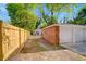 The backyard features a 2-car detached garage and a new wooden fence at 1150 Tinsley Nw Dr, Conyers, GA 30012
