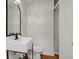 Contemporary bathroom featuring modern sink, storage, and large mirror at 1150 Tinsley Nw Dr, Conyers, GA 30012