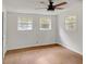 A bright, airy bedroom featuring hard surface floors and bright white paint at 1150 Tinsley Nw Dr, Conyers, GA 30012