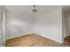 Unfinished bedroom featuring light fixture and wood flooring at 1150 Tinsley Nw Dr, Conyers, GA 30012