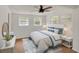 Bright bedroom featuring wood floors, natural light, and simple decor to make a peaceful retreat at 1150 Tinsley Nw Dr, Conyers, GA 30012