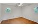 Bedroom featuring wood-look floors, fresh paint, and natural light at 1150 Tinsley Nw Dr, Conyers, GA 30012