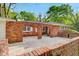 Unique red brick courtyard featuring arched entryways and a spacious concrete patio at 1150 Tinsley Nw Dr, Conyers, GA 30012