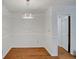Dining area illuminated by modern lighting, wood-look floors, and white trim at 1150 Tinsley Nw Dr, Conyers, GA 30012