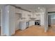 Kitchen featuring new cabinets, modern appliances, and wood-look floors at 1150 Tinsley Nw Dr, Conyers, GA 30012