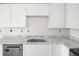 Close up of kitchen with granite countertops, stainless steel appliances, and new cabinets at 1150 Tinsley Nw Dr, Conyers, GA 30012