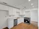 Modern kitchen with granite counters, stainless steel appliances, and white cabinetry at 1150 Tinsley Nw Dr, Conyers, GA 30012