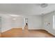 Bright living room featuring wood-look floors, white walls, and modern light fixtures at 1150 Tinsley Nw Dr, Conyers, GA 30012