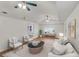 Inviting living room with bright neutral colors, comfortable seating, and ample natural light at 1150 Tinsley Nw Dr, Conyers, GA 30012