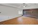 Living room boasting vaulted ceiling, brick fireplace, and wood-look floors at 1150 Tinsley Nw Dr, Conyers, GA 30012