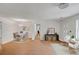 Spacious living room with wood floors, dining area, console table, and neutral decor create a welcoming atmosphere at 1150 Tinsley Nw Dr, Conyers, GA 30012