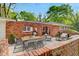 Beautiful brick patio with outdoor seating, creating an inviting and relaxing space for entertaining guests at 1150 Tinsley Nw Dr, Conyers, GA 30012