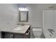 Bathroom features a modern vanity with sink and shower with updated fixtures at 130 Fairview Dr, Stockbridge, GA 30281