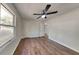 Large bedroom features sleek ceiling fan, natural lighting, and well maintained wood flooring at 130 Fairview Dr, Stockbridge, GA 30281