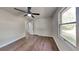 Inviting bedroom featuring wood floors, closet space, natural lighting and a ceiling fan at 130 Fairview Dr, Stockbridge, GA 30281