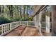 Back deck overlooking a wooded yard with sliding door access from the house at 130 Fairview Dr, Stockbridge, GA 30281