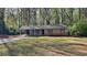 Charming single-story home featuring stone accents and a well-maintained lawn at 130 Fairview Dr, Stockbridge, GA 30281
