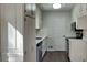 Cozy kitchen featuring stainless steel appliances, white cabinetry, and ample counter space at 130 Fairview Dr, Stockbridge, GA 30281