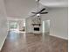 Open concept living area features a stone fireplace and easy access to the kitchen and deck at 130 Fairview Dr, Stockbridge, GA 30281