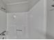 Bathroom features a shower with updated fixtures and neutral decor at 130 Fairview Dr, Stockbridge, GA 30281