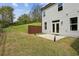 Expansive backyard with a patio and well-maintained lawn, offering privacy and ample space for activities at 2310 Portrush Se Way, Atlanta, GA 30339