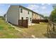 Well-sized backyard with a patio, grassy area, and fenced perimeter, offering a private outdoor space at 2310 Portrush Se Way, Atlanta, GA 30339