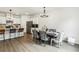 Contemporary dining area with a stylish table and modern lighting, open to kitchen with bar stool seating at 2310 Portrush Se Way, Atlanta, GA 30339