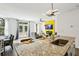 Bright living room with backyard access, dining space and stylish kitchen featuring granite countertops at 2310 Portrush Se Way, Atlanta, GA 30339