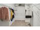 Walk-in closet with ample shelving and hanging space for organized storage of clothing and accessories at 2310 Portrush Se Way, Atlanta, GA 30339