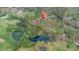 Located near a pond, aerial view of the property highlighting its natural surroundings and privacy at 240 Wrights Mill Way, Canton, GA 30115