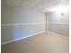 Unfurnished basement with neutral flooring and simple architectural details at 240 Wrights Mill Way, Canton, GA 30115