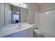 Bathroom with tub/shower, large mirror, and single sink vanity at 240 Wrights Mill Way, Canton, GA 30115