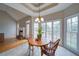 Sunlit breakfast nook with hardwood and tile flooring, adjacent to the living room at 240 Wrights Mill Way, Canton, GA 30115