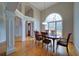 Bright dining room with hardwood floors, columns, and large windows at 240 Wrights Mill Way, Canton, GA 30115