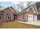 Attractive brick home with a two-car garage and arched window at 240 Wrights Mill Way, Canton, GA 30115
