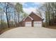Brick home with a spacious driveway and a two-car garage at 240 Wrights Mill Way, Canton, GA 30115