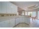 Bright, white kitchen area with eat-in breakfast nook featuring tile backsplash at 240 Wrights Mill Way, Canton, GA 30115