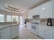 Bright, white kitchen with breakfast nook and plenty of cabinet space at 240 Wrights Mill Way, Canton, GA 30115