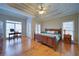 Serene main bedroom featuring hardwood floors, tray ceilings and natural light at 240 Wrights Mill Way, Canton, GA 30115