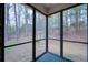 Screened porch with views of the backyard and a white arbor at 240 Wrights Mill Way, Canton, GA 30115