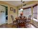 Bright breakfast nook with woven shades and cozy seating beside the laundry room at 3420 Sweetbriar Ln, Powder Springs, GA 30127