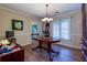Formal dining room with hardwood floors and classic chandelier for elegant meals at 3420 Sweetbriar Ln, Powder Springs, GA 30127