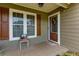 Inviting front porch featuring a wood door, shutters, and a 'Welcome' mat, perfect for greeting guests at 3420 Sweetbriar Ln, Powder Springs, GA 30127