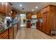 Spacious kitchen features wooden cabinets, stainless steel appliances and stone countertops at 3420 Sweetbriar Ln, Powder Springs, GA 30127