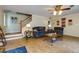 Inviting living room with comfortable seating and natural light from nearby stairs at 3420 Sweetbriar Ln, Powder Springs, GA 30127