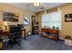 Home office with two wooden desks, computer, natural light from window, and rolling chair at 3420 Sweetbriar Ln, Powder Springs, GA 30127